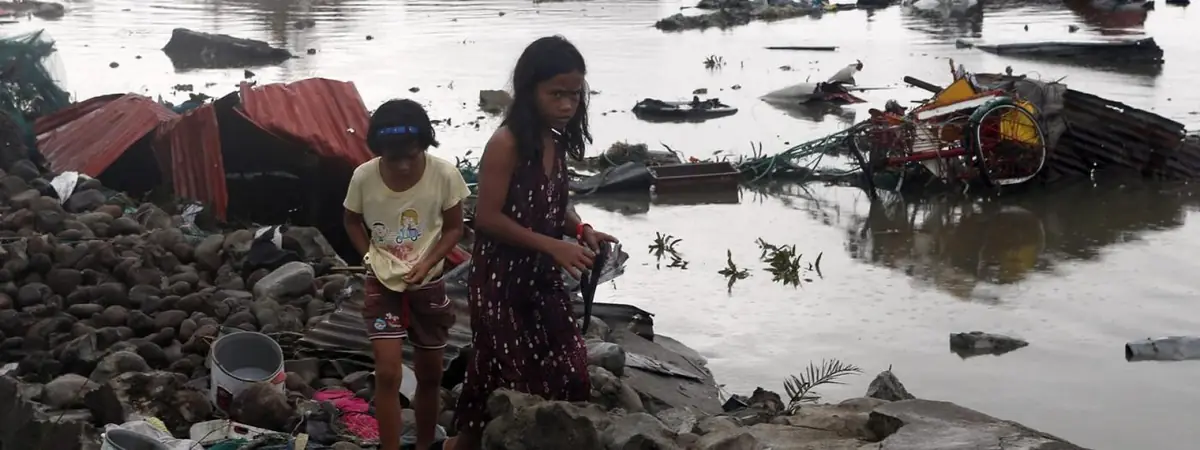 Sisters walking the shoreline after their home was lost