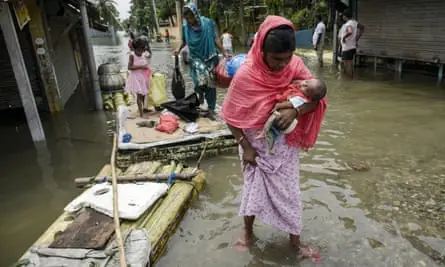 She held the baby above the water